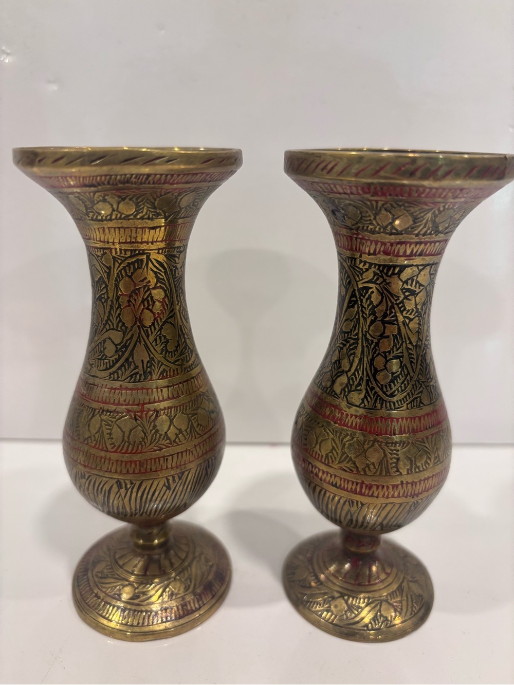 Vintage pair of Indian solid brass engraved bud vases red black enamel floral
